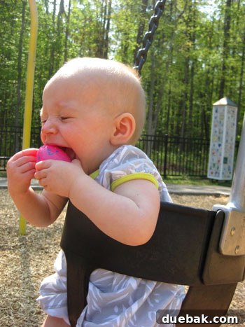 Easter Steals 5 Clara swinging happily on a playground, still holding her treasured Easter eggs