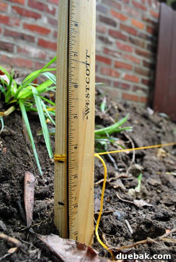 Achieving a Flawless Foundation for Your Paver Patio 13 Adjusting string lines to create the correct patio slope