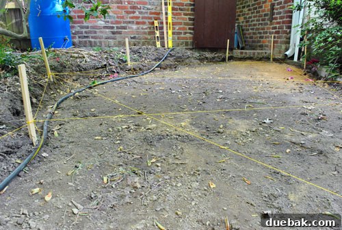 Achieving a Flawless Foundation for Your Paver Patio 17 Excavated patio area, resembling an archaeological dig site