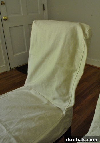 Slipcover on chair, showing loose fit before washing