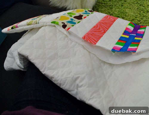 Hand stitching the opening of a flipped-out quilt