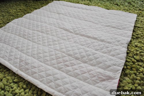 The cozy, white backing of the finished quilt