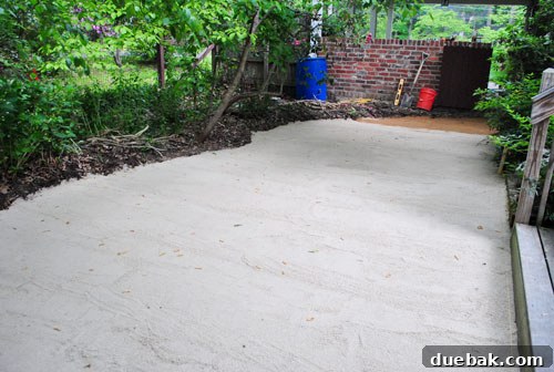 Fully leveled sand bedding layer for the patio, showing a consistent surface