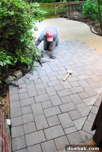 Sherry and I working together to lay the first pavers on the new patio