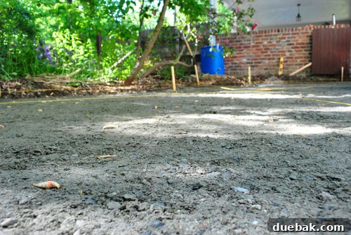Compacted gravel base, now a flat and solid surface ready for sand