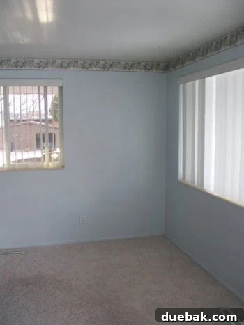 Front room before transformation: baby blue walls and floral border