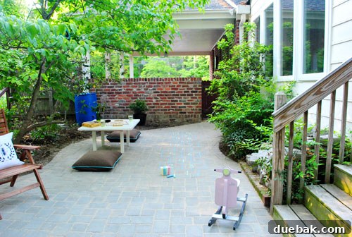 DIY Paver Patio: Transform Your Backyard 23 Temporary patio setup with scrabble
