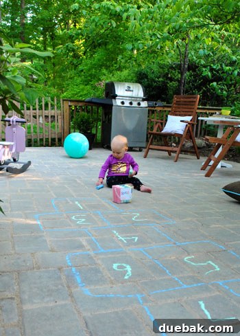 DIY Paver Patio: Transform Your Backyard 25 Clara playing on the new patio