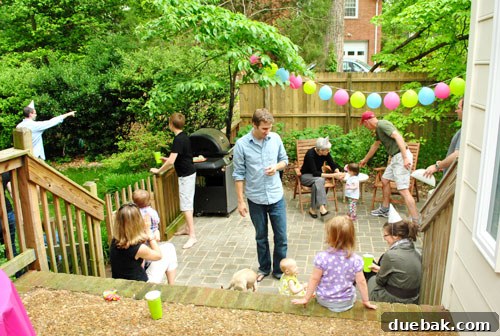A simple party spread with pizza, chips, and drinks, emphasizing ease of preparation.