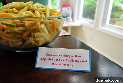 Veggie sticks, one of Clara's favorite snacks, displayed with a personalized card.