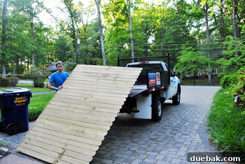 Crafting Your Perfect Property Border 4 Lowe's rental truck loaded with new wooden fence panels and posts, ready for the DIY fence project