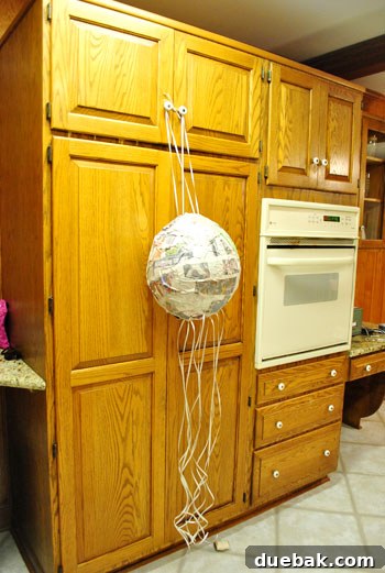 Craft Your Own Pull String Piñata 17 Hanging the piñata shell for easy decoration