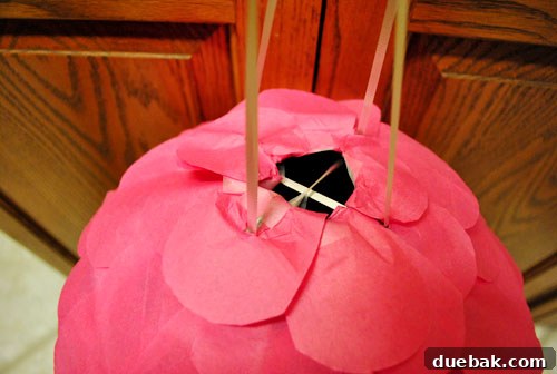 Craft Your Own Pull String Piñata 19 Finished pull-string piñata, decorated with pink scales