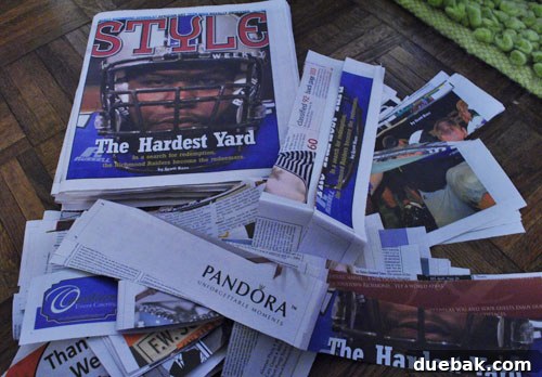 Craft Your Own Pull String Piñata 4 Applying paper mache newspaper strips to balloon