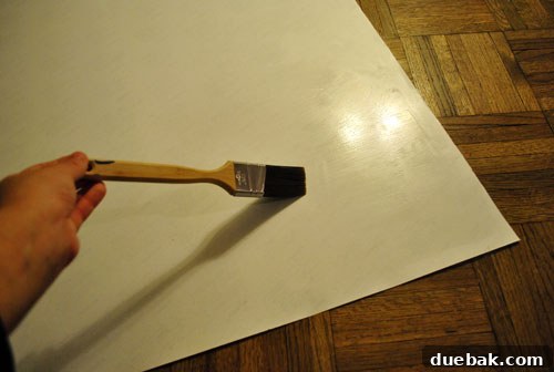 Securely Mounting Large Prints to Canvas Using Acrylic Medium 8 Applying acrylic medium to the back of the print for durable adhesion