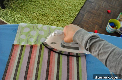 Ironing the back of the seams to lay flat