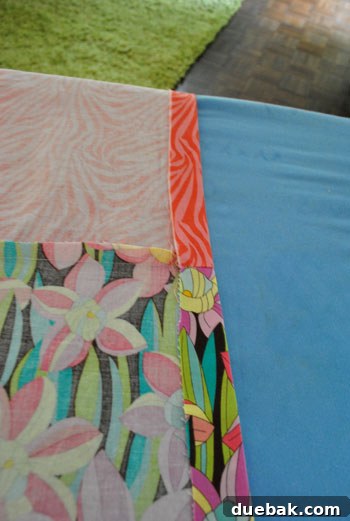 Ironing the long sides of the runner to prepare for hemming
