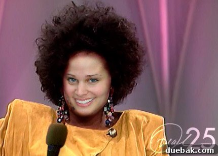 Oprah-fied image of the author with iconic big hair and glamorous jewelry