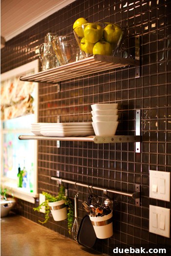 Sophisticated glass tile accent wall in Kelly Moore's kitchen