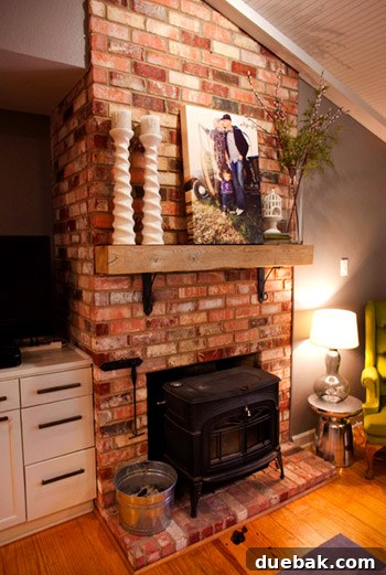 Rustic brick fireplace and lofted ceilings in Kelly Moore's living room