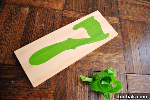 Pressing down remaining painter's tape edges before painting