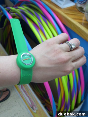 A display of colorful snap bracelet watches in a toy store, evoking a sense of nostalgia for a past trend.