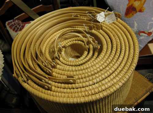 A set of beautifully crafted, tightly nested baskets displayed for sale in the Antique Mall.