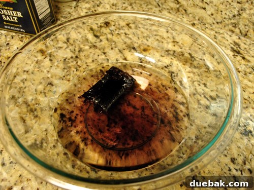 Dissolving brown iDye packet in hot water