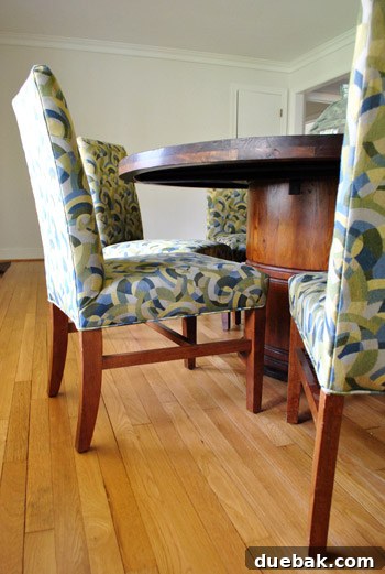 Before image of dining chairs with green slipcovers