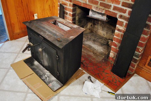 The wood stove detached from the chimney vent