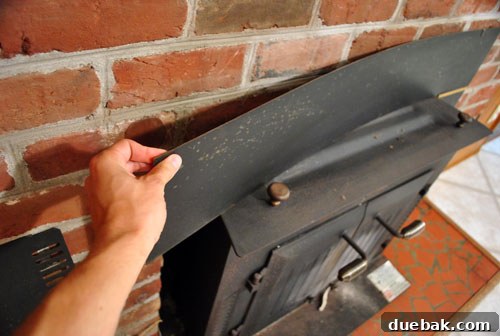 Side view of the wood stove after removing the flashing