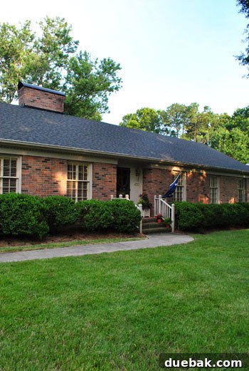 Inside a Stunning North Carolina Home 2 Charming 1960s brick ranch home exterior in Charlotte, North Carolina, after renovation