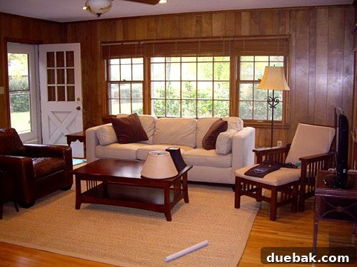 Inside a Stunning North Carolina Home 11 Before shot of the family room, showing original dark wood paneling and a more enclosed space
