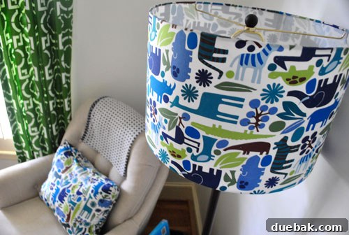 Inside a Stunning North Carolina Home 14 Davis's charming nursery featuring custom patterned Duralee curtains and a fabric-covered drum shade