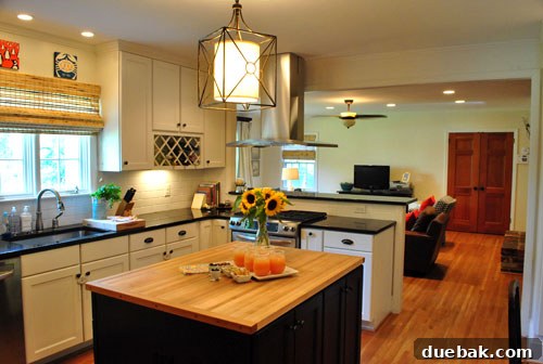 Inside a Stunning North Carolina Home 6 Wide view of the renovated open-concept kitchen seamlessly flowing into the family room