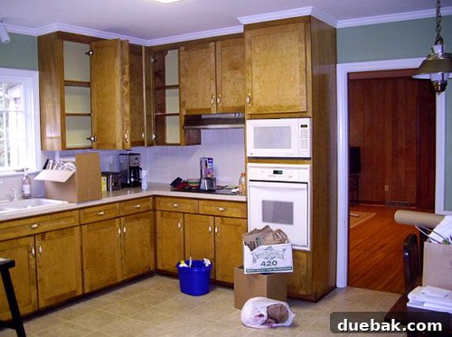 Inside a Stunning North Carolina Home 7 Before shot of the kitchen from the same angle, illustrating its original closed-off and dated layout