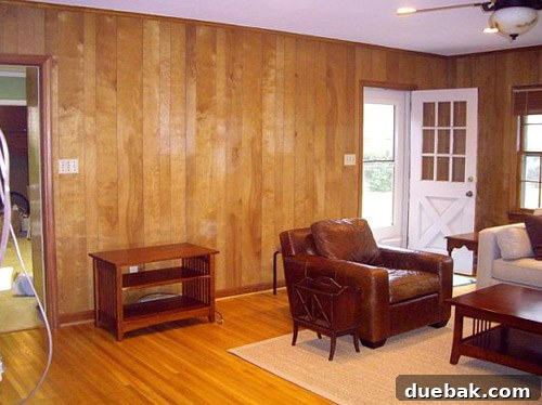 Inside a Stunning North Carolina Home 9 Before shot of the family room from the same angle, showing a narrow door leading to the kitchen