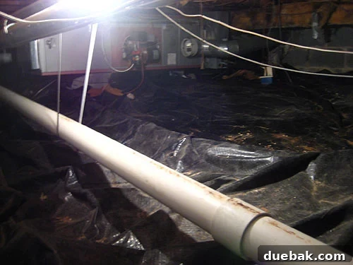 radoninthecrawlspace A view of a sealed crawl space with an airtight plastic sheet, part of a radon mitigation system