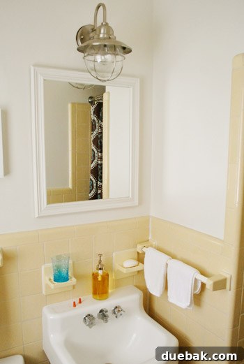 Shedding New Light on Our Bathroom 17 New light fixture in the context of the unfinished bathroom