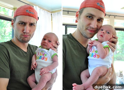 Dad holding baby Clara on Father's Day last year