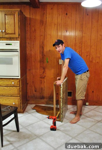 Removing Cabinets and Repairing Vinyl Flooring 17 Person looking exhausted after struggling to remove the heavy granite desk countertop