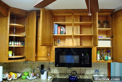 Removing Cabinets and Repairing Vinyl Flooring 8 Junk drawer and desk area before removal, highlighting its clutter-prone nature
