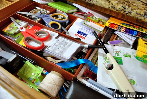 Kitchen island view showing empty drawers on the side, ready for organization.