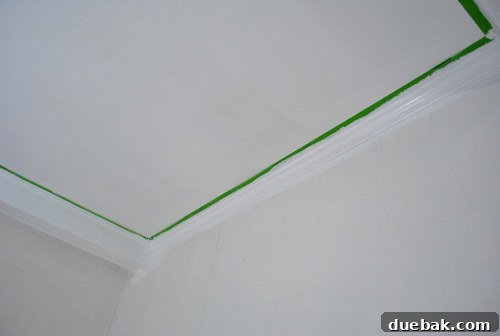 Preparing Wood Paneling for a Flawless Finish 11 Freshly painted white trim and beams
