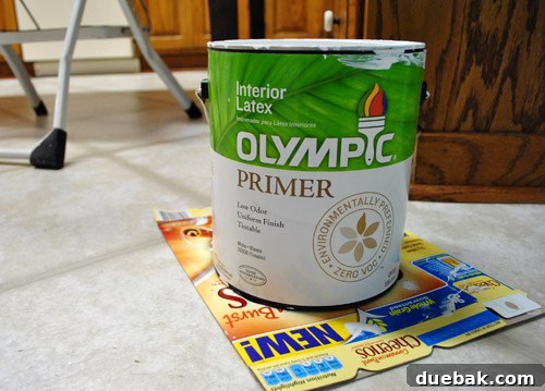 Preparing Wood Paneling for a Flawless Finish 6 Applying first coat of Olympic No-VOC primer
