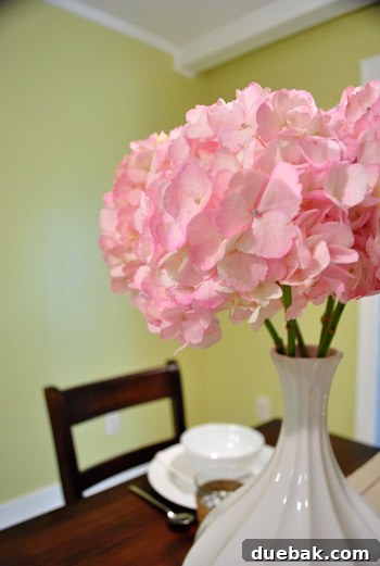 Revamping Our Wood Paneling with Paint 19 Pink hydrangeas in a vase on the newly painted kitchen counter