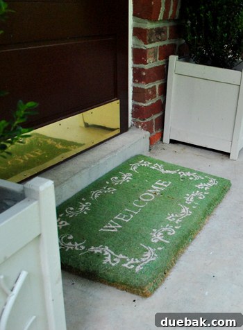 Welcome mat on the porch, still looking good despite its age