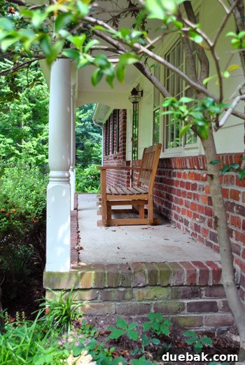 Detailed shot of the unadorned porch floor and door