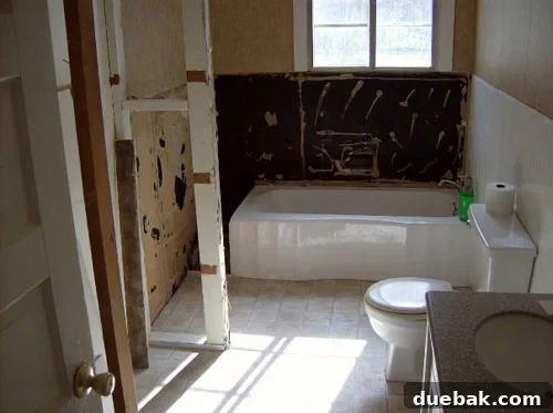 Outdated bathroom before renovation, showing original 1924 condition