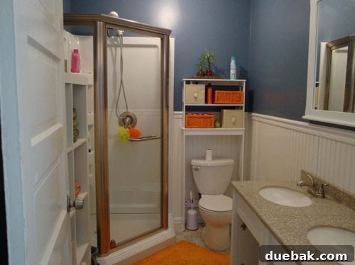 Stunning modern bathroom after renovation, featuring new fixtures and design